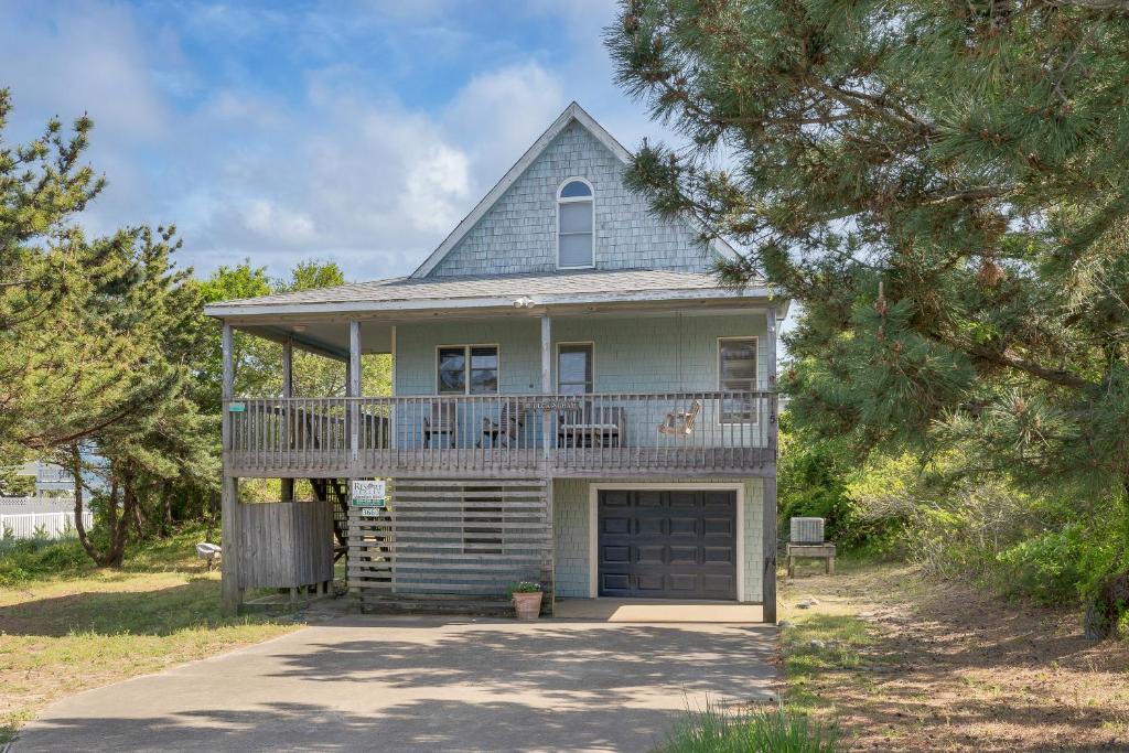 a large house with a balcony and a porch at 3660 - Duckingham in Duck