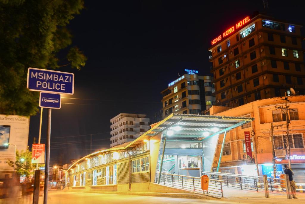 a nisska police station on a city street at night at Hong Kong Hotel in Dar es Salaam