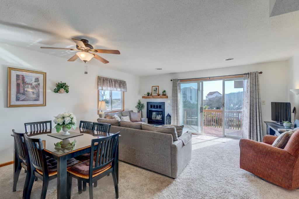 a living room with a couch and a table at 4220 - Timeless in Duck