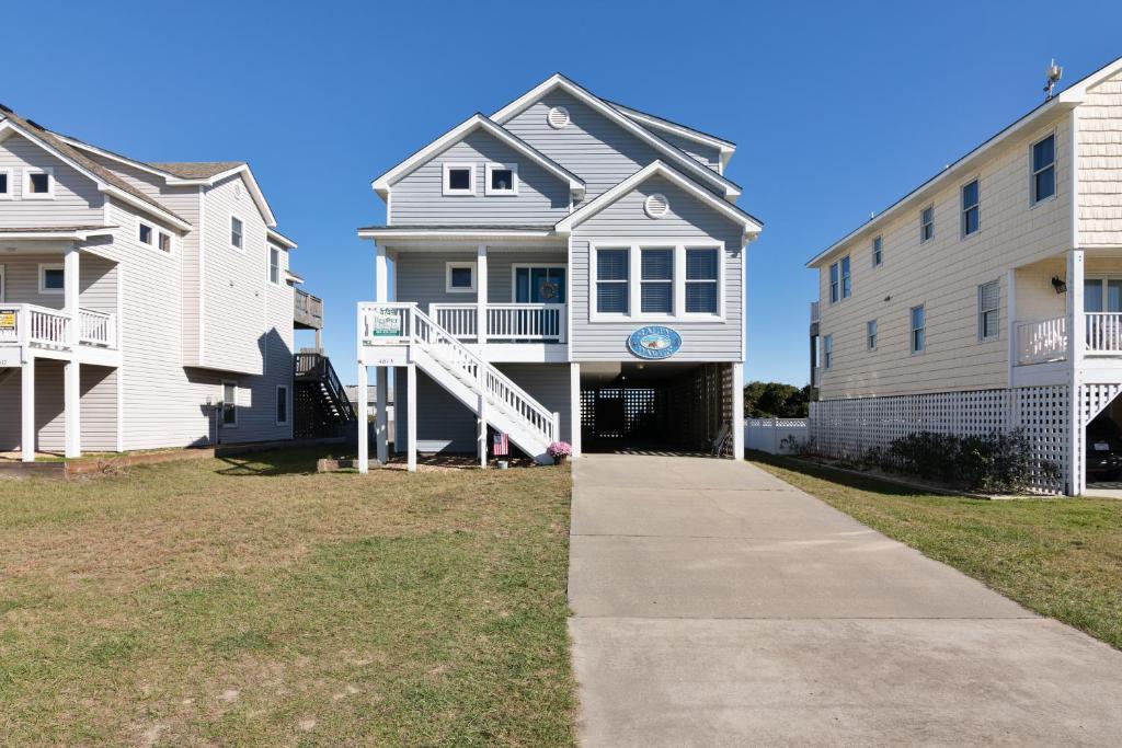 a row of houses on a street at 4749 - Salty Dawgs in Kitty Hawk Beach