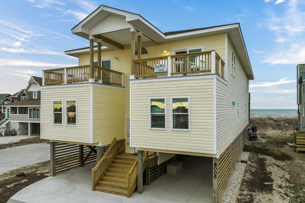 a house on the beach with a view of the ocean at 5725 - A Dream Vacation in Nags Head