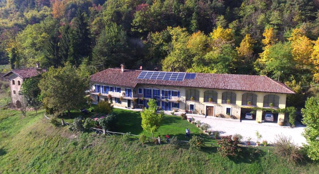 an aerial view of a house with a solar roof at B&B Il Sole Delle Rive in Sinio