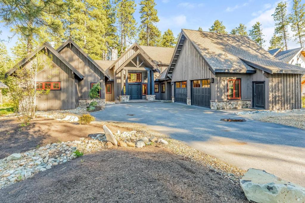 a large house with a driveway in front of it at Wine Down in Cle Elum