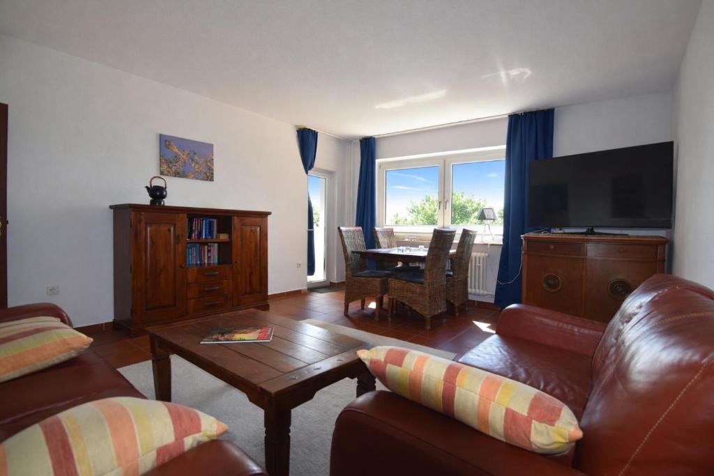a living room with a couch and a table at fewo1846 - Ostseebad - Apartment mit 2 Schlafzimmern und Meerblick in Flensburg