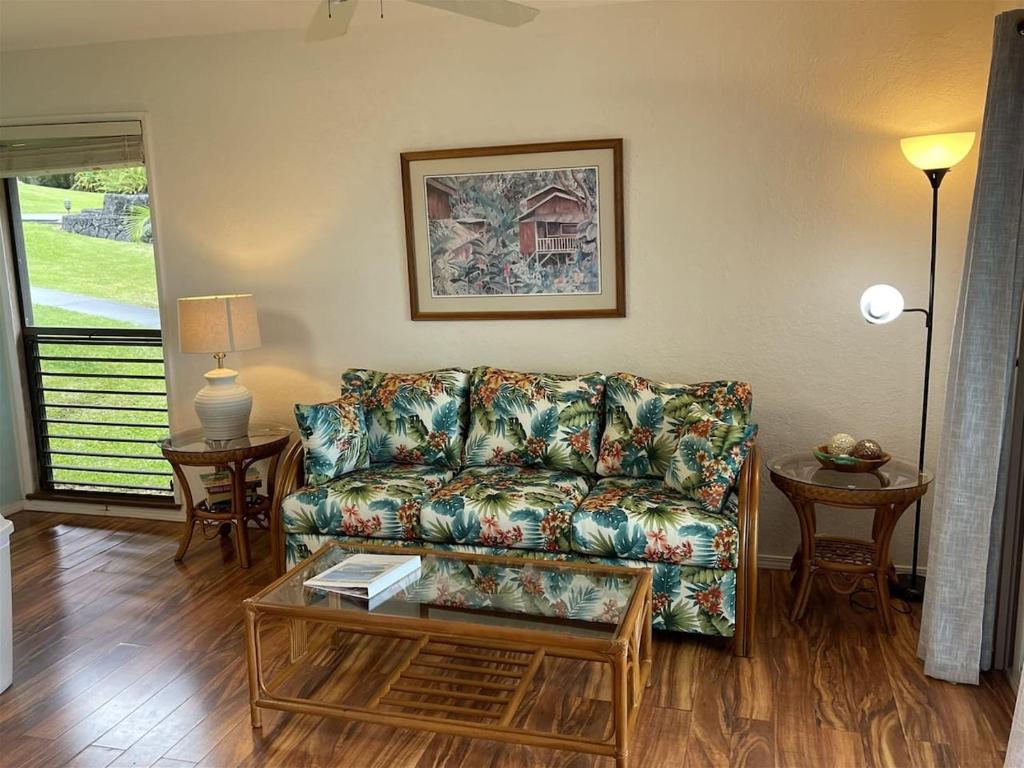 a living room with a couch and a table at Unit 11 Beautiful Ocean View in Pahala
