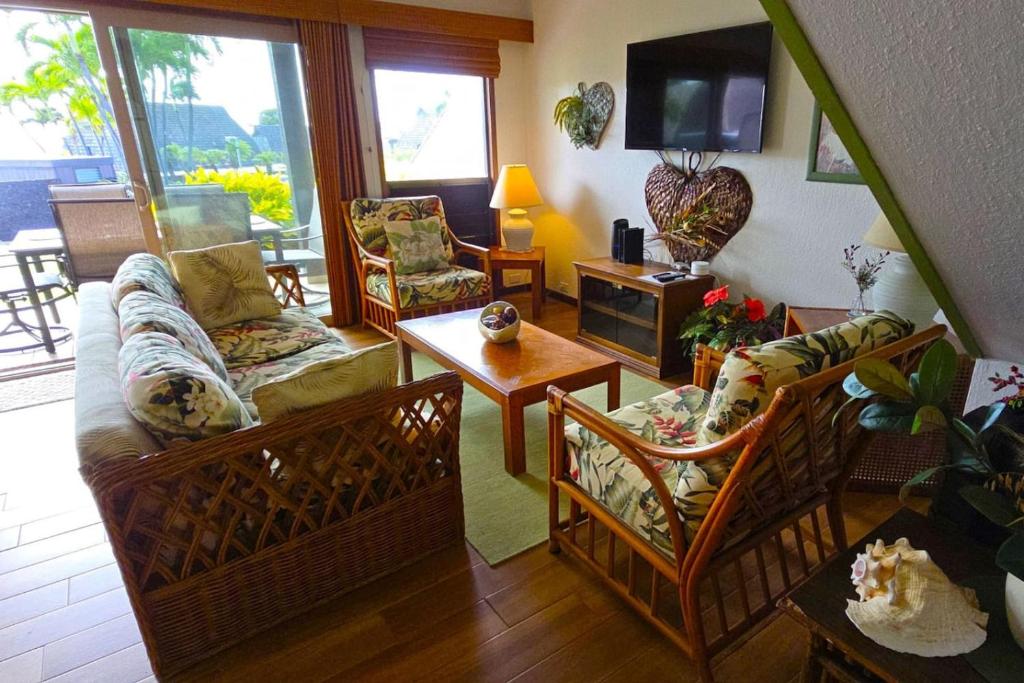 a living room with a couch and a tv at 58 2 bedroom 2 bath in Pahala