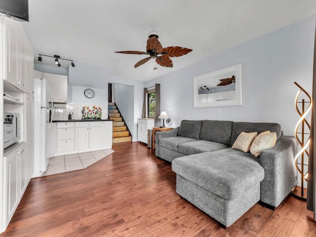 a living room with a couch and a kitchen at 57 Beautiful Remodeled Studio in Pahala