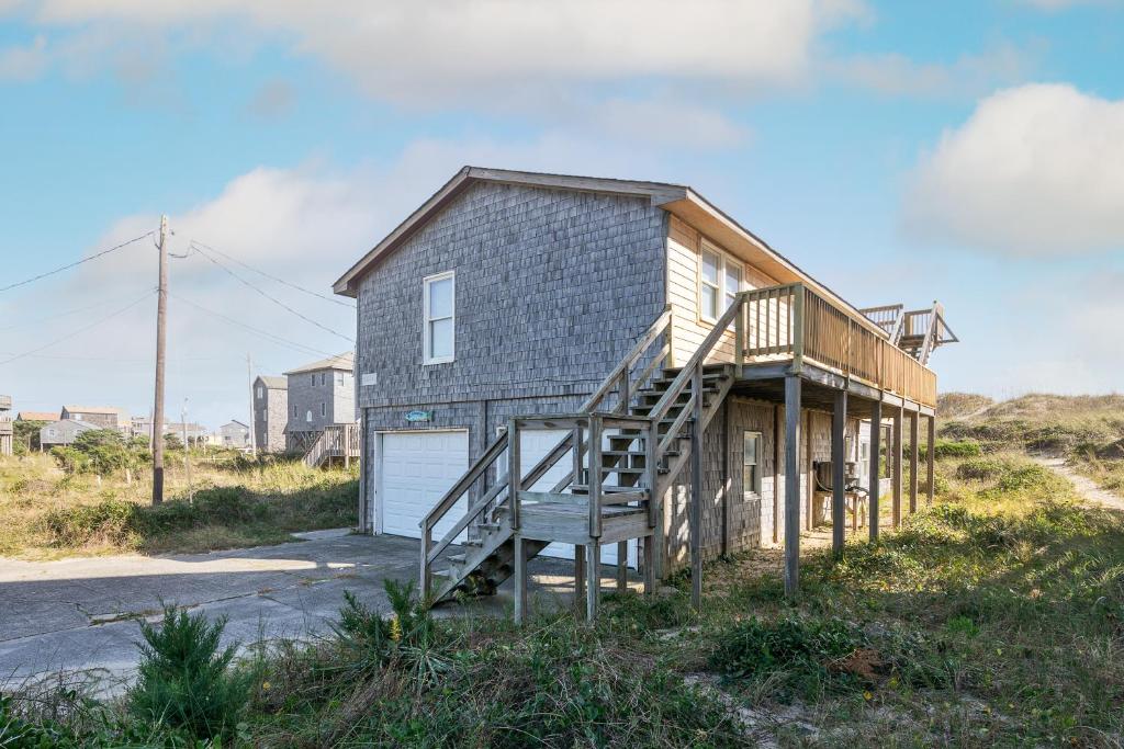 a house with a staircase in front of it at 7847 - Summerset in Frisco