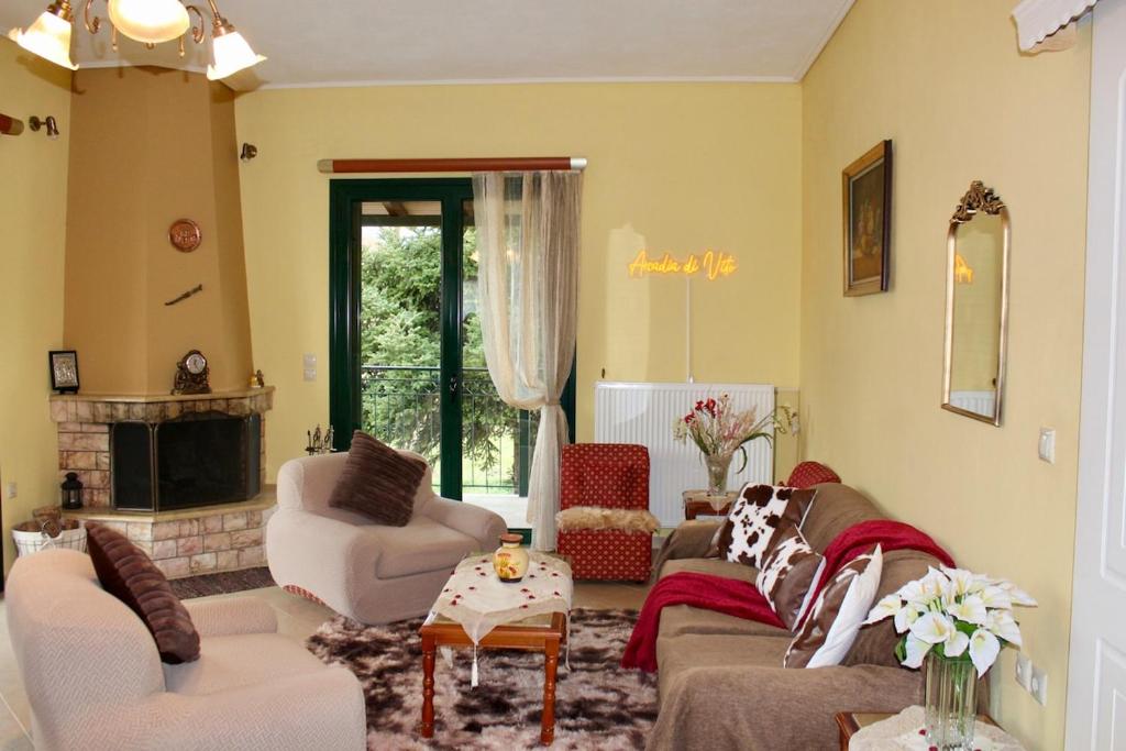 a living room with two couches and a fireplace at Arcadia di Vito in Tripoli