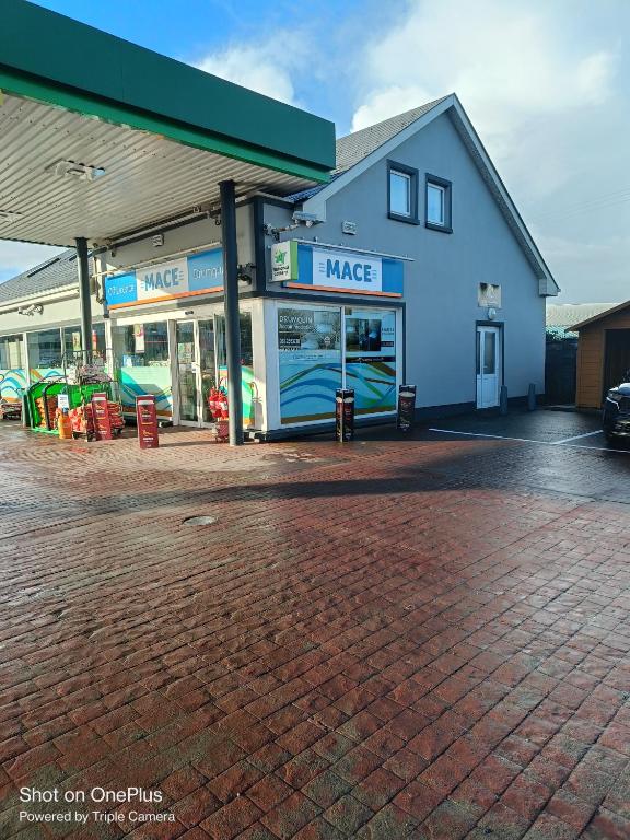a gas station with amake sign on the front at Drumquin Accommodation in Ennis