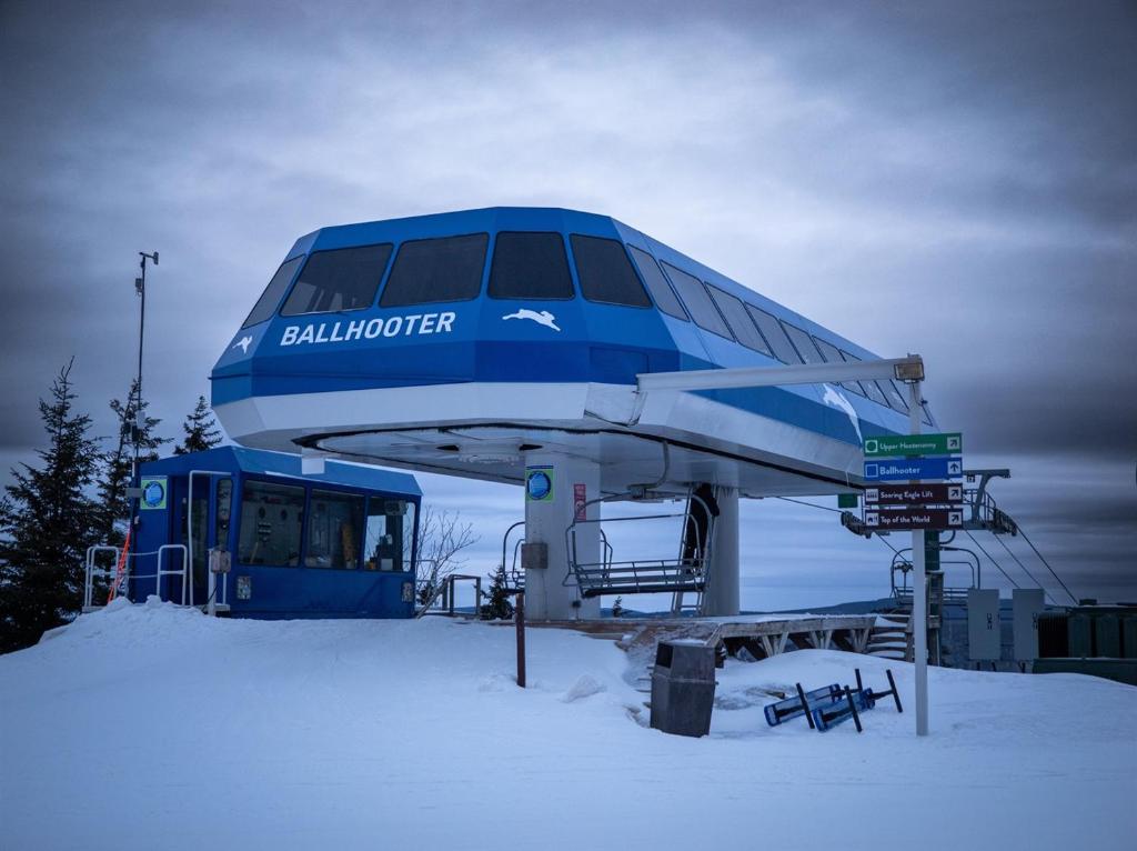 a blue and white ski lift in the snow at ML 345 Ski-InOut Slope Views Sleeps 6 Steps to Ballhooter in Snowshoe