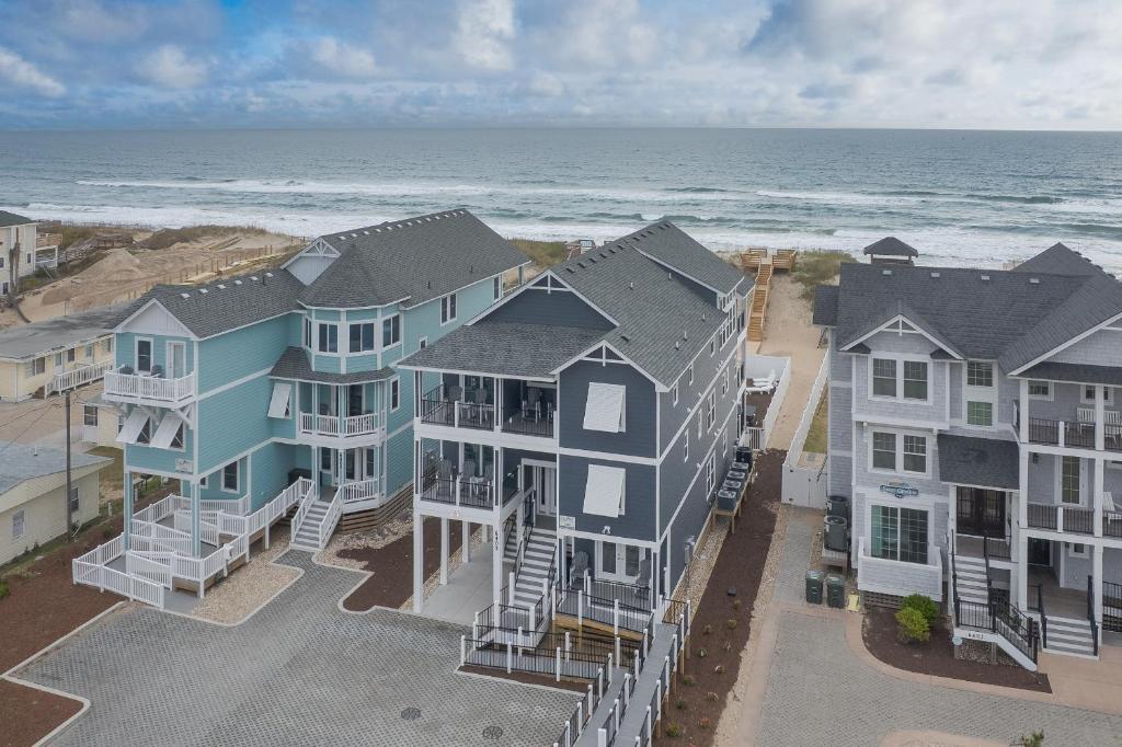 an aerial view of a row of houses on the beach at 5705 - Edgewater View in Nags Head
