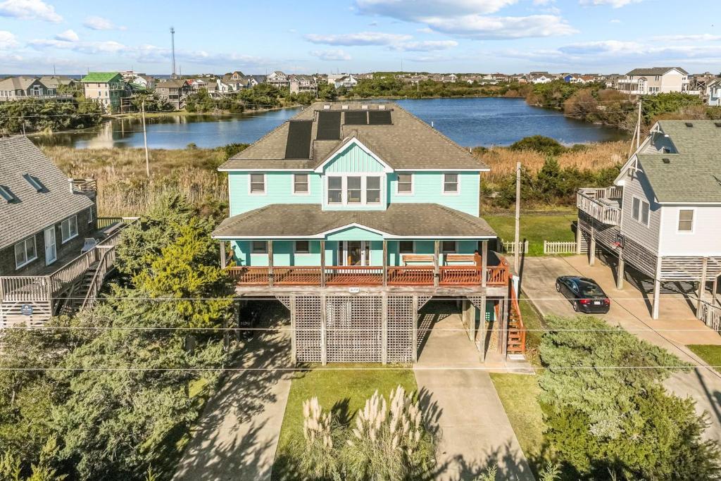 an aerial view of a house with a large deck at 7200 - Better Surf Than Sorry in Salvo