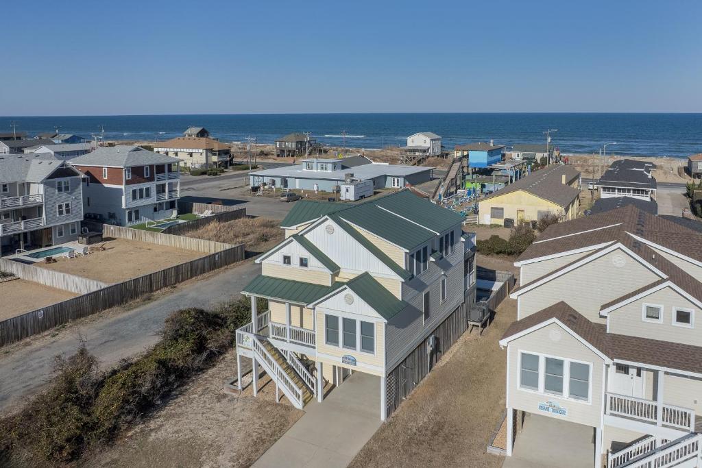 an aerial view of a town with houses and the ocean at 4744 - Sandy Beaches in Kitty Hawk Beach