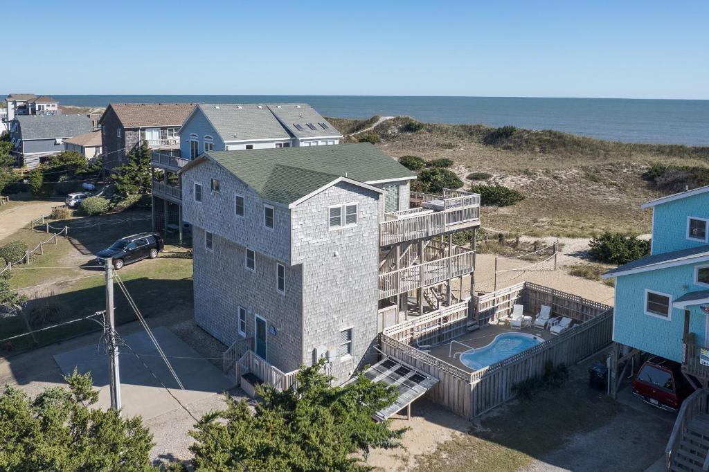 an aerial view of a house with a pool at 7158 - A Wave From It All in Waves