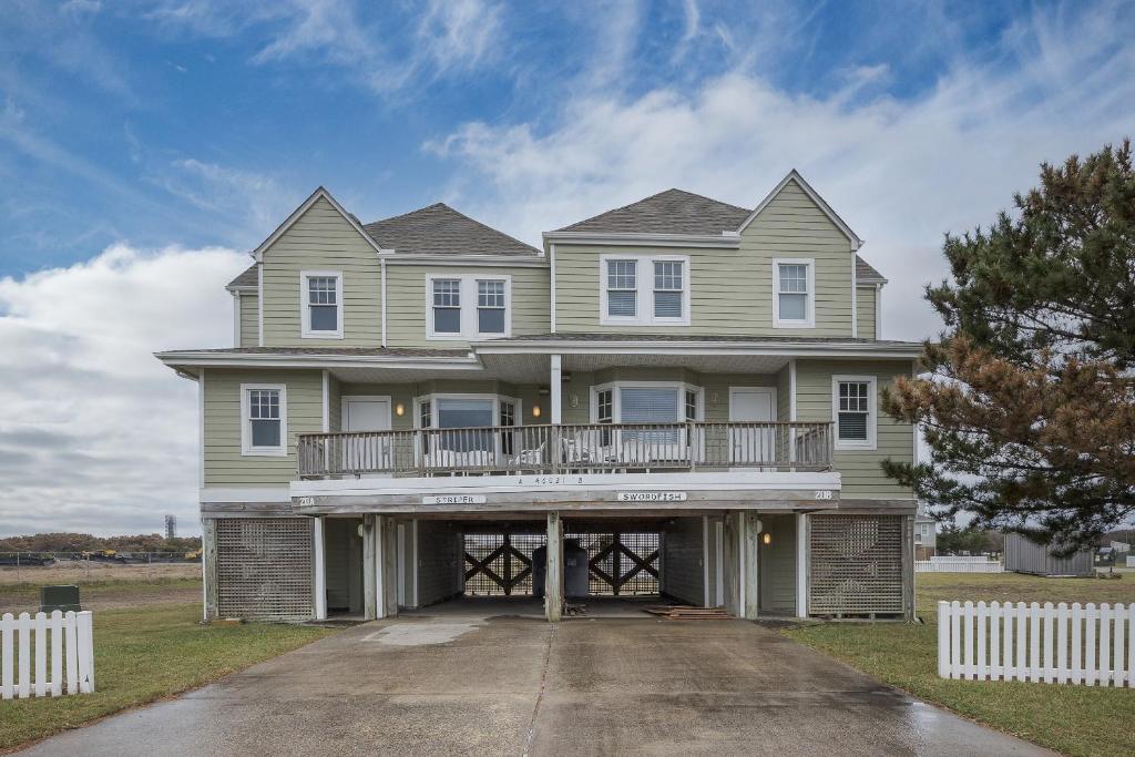 a large house with a balcony on a driveway at 7767 - Swordfish in Buxton