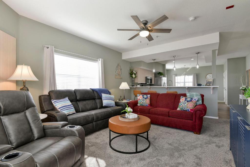 a living room with two couches and a table at Amazing 2 bed 2 bath with Gorgeous View in Branson