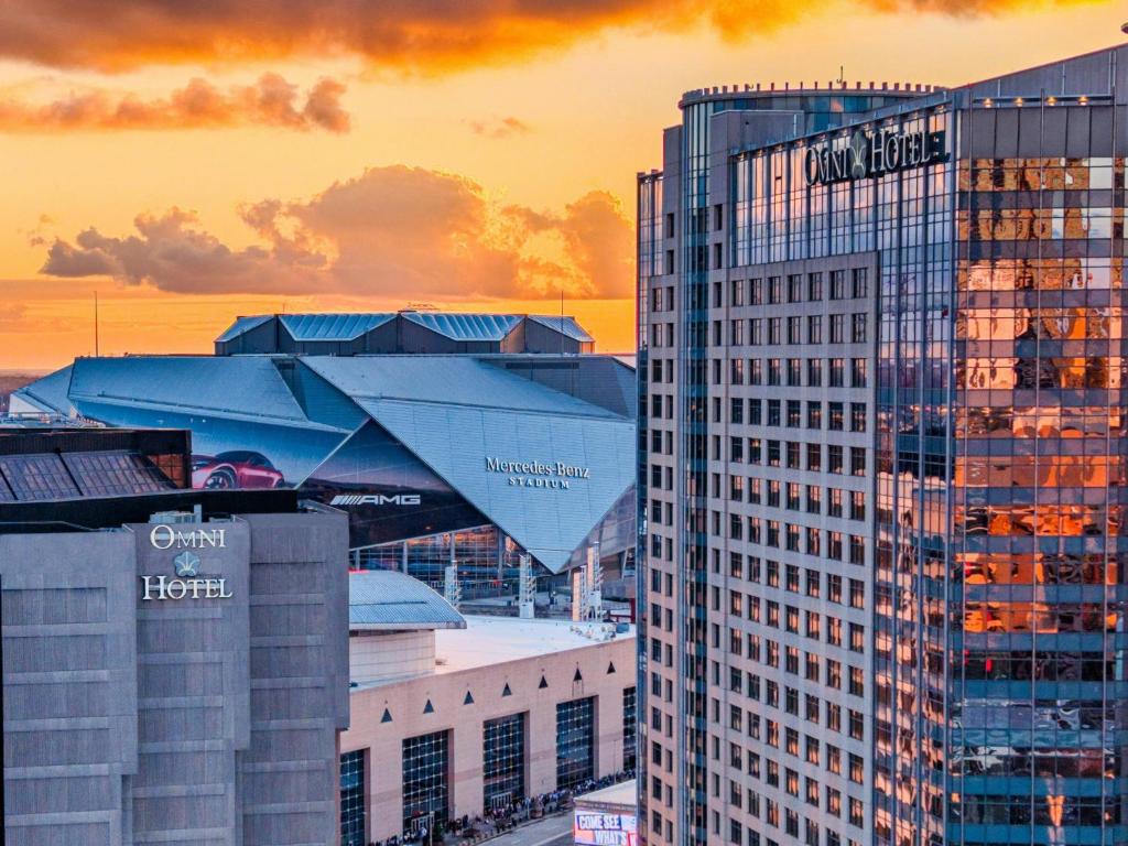a view of two tall buildings in a city at Omni Atlanta Hotel at Centennial Park in Atlanta