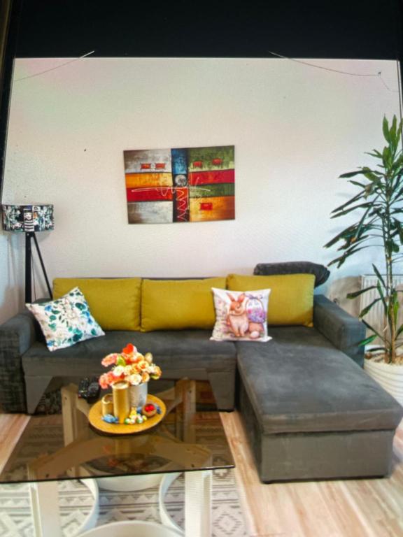 a living room with a couch and a table at Happy M&S in Šabac