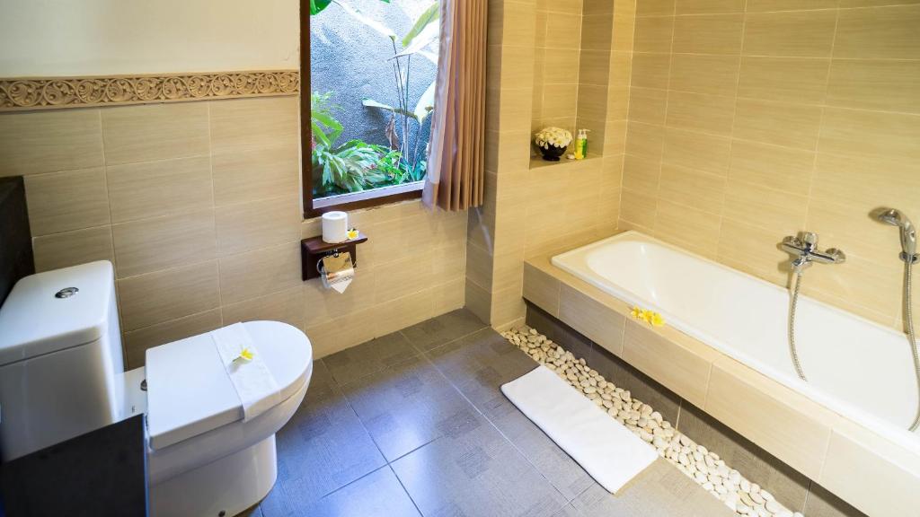 Koupelna v ubytování Kori Ubud Resort, Restaurant & Spa