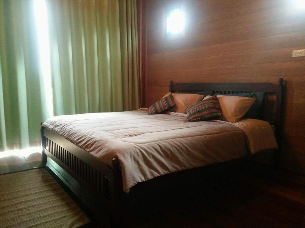 Postel nebo postele na pokoji v ubytování Calm at Bangphat
