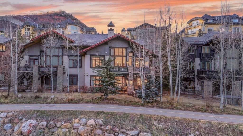 a large house with a road in front of it at Bergrose Lodge in Vail