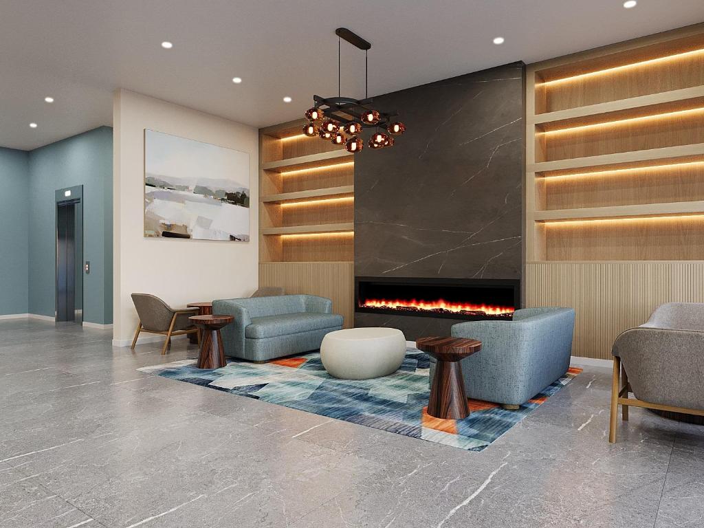 a lobby with couches and a fireplace at Hotel Bridgton in Bridgton