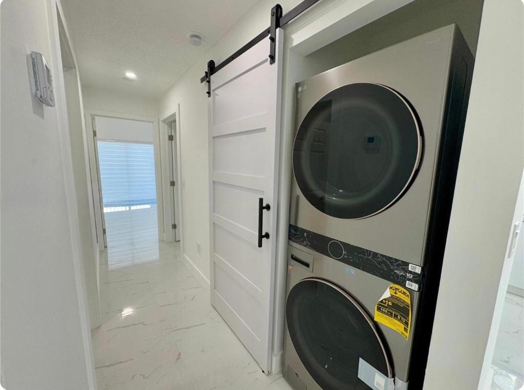 a laundry room with a washer and dryer at Beautiful House Near Marlins Stadium in Miami