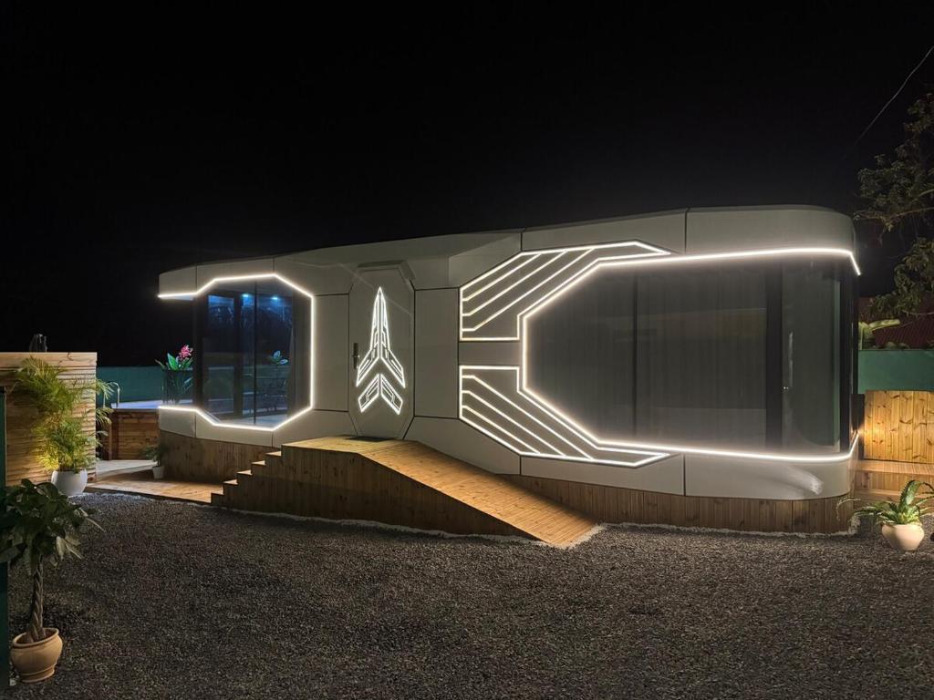 a building with lights on the side of it at Maison du Future in Capesterre-Belle-Eau
