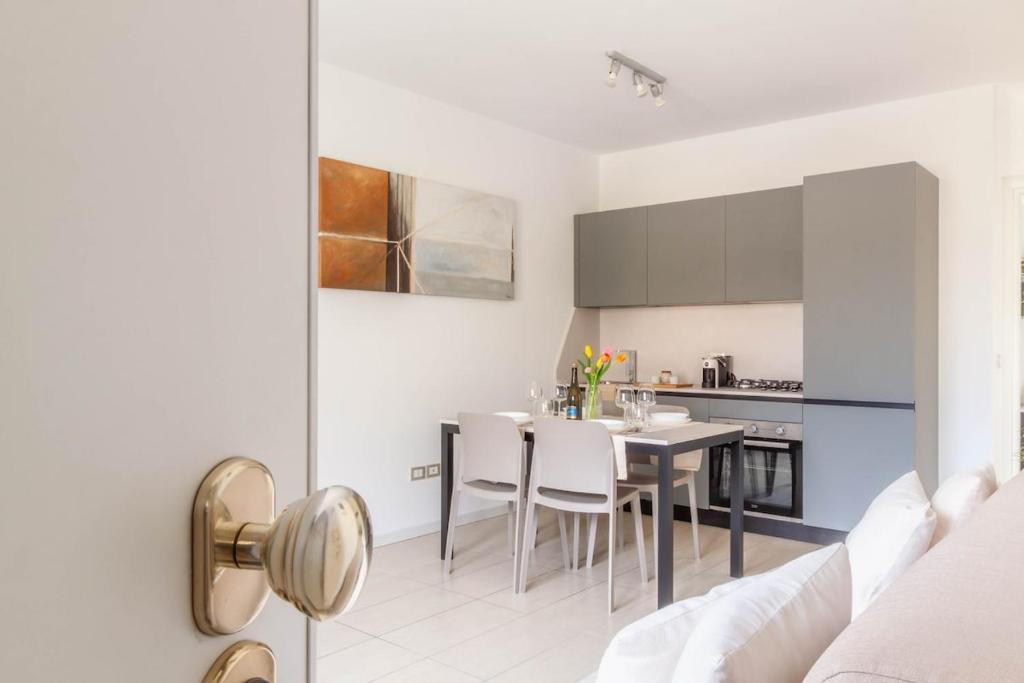 a kitchen and dining room with a table and chairs at Apartment in Serravalle in Vittorio Veneto