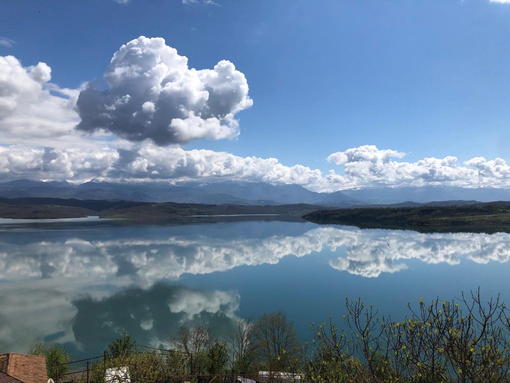 a view of a lake with clouds in the sky at Ulza Lake Escape in Ulëz