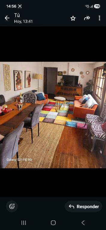 a living room with a couch and a table at Casa Santa María 2 con jardín y barbacoa in Arévalo