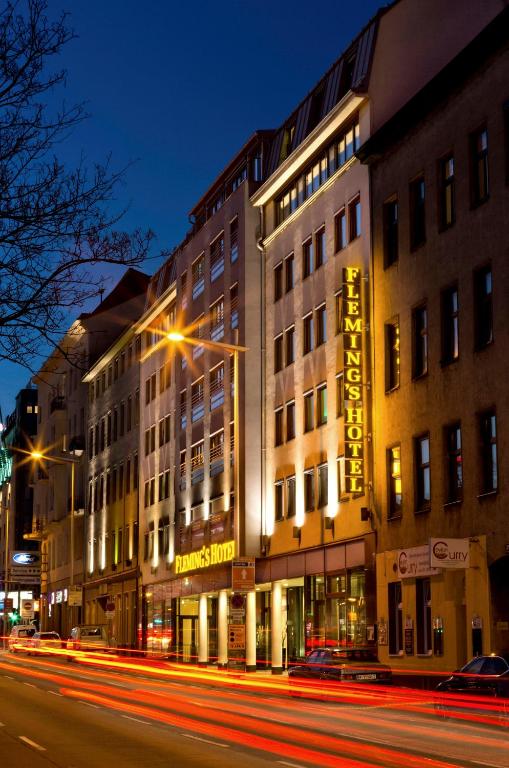 a building on a city street at night at Flemings Hotel Wien-Stadthalle in Vienna