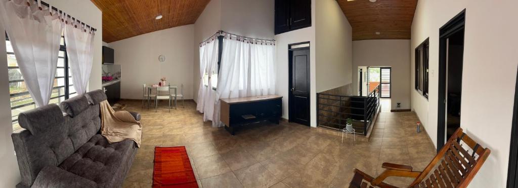 a living room with a couch and a table at Casa Armonía Popayán in Popayan