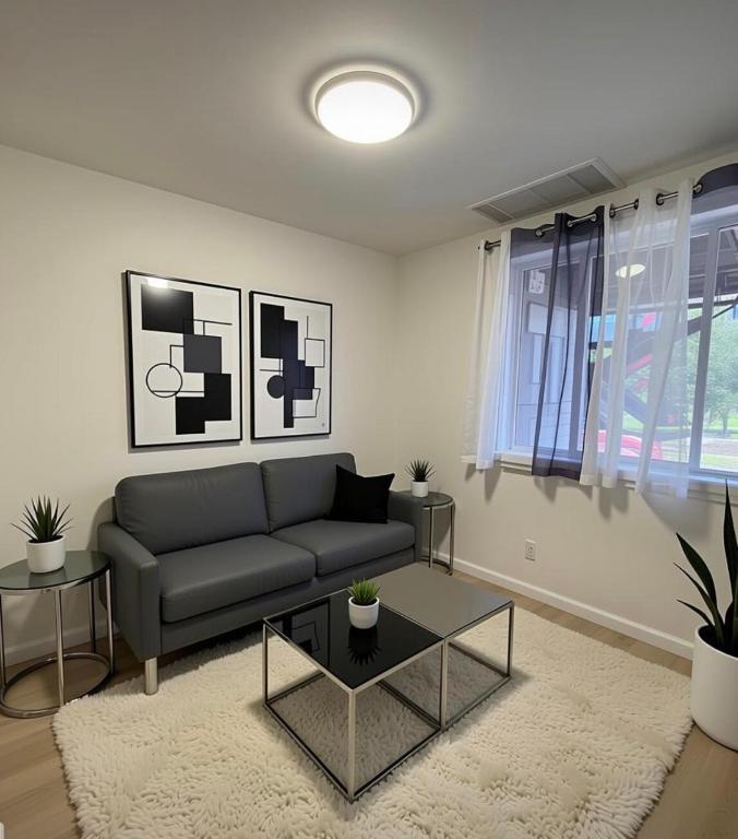 a living room with a couch and a table at Modern 2BR 2BA Apartment Garden-View in San Francisco
