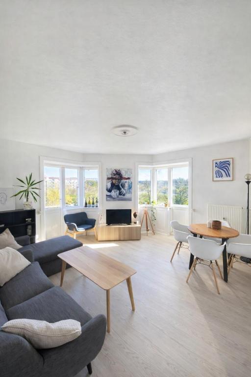 a living room with a couch and a table at Danish style apartment in Copenhagen