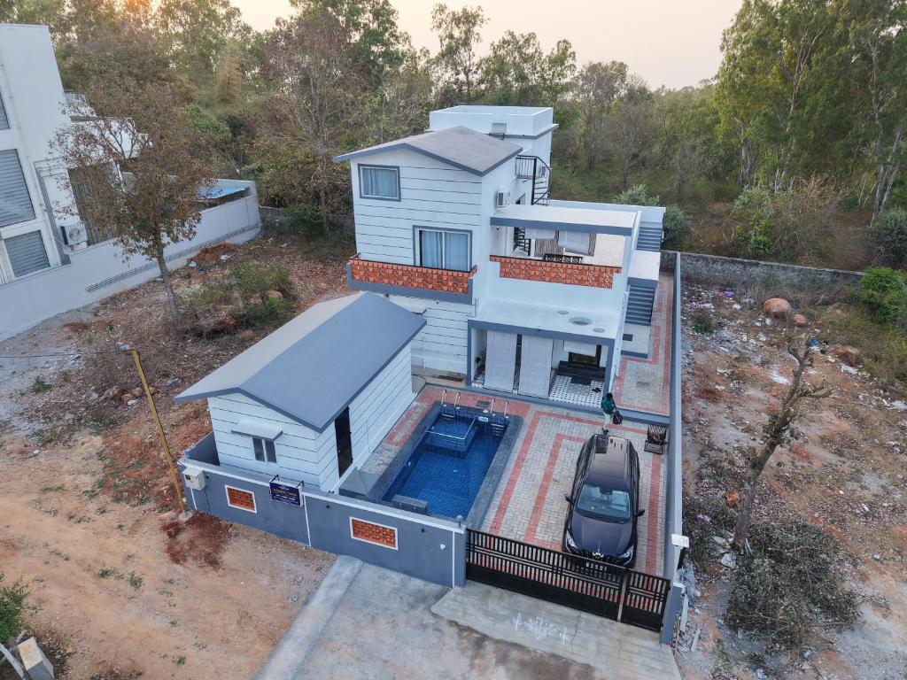 an aerial view of a house with a swimming pool at Yelagiri castle in Yelagiri