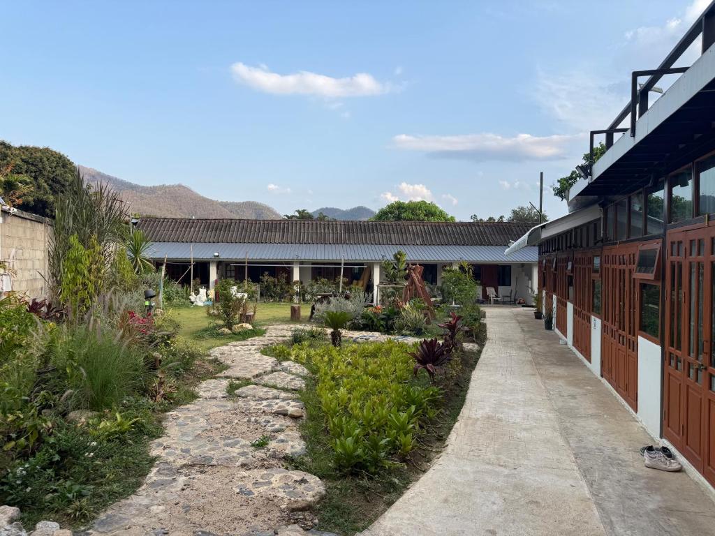 a garden in front of a building at Hidden Valley Pai in Pai