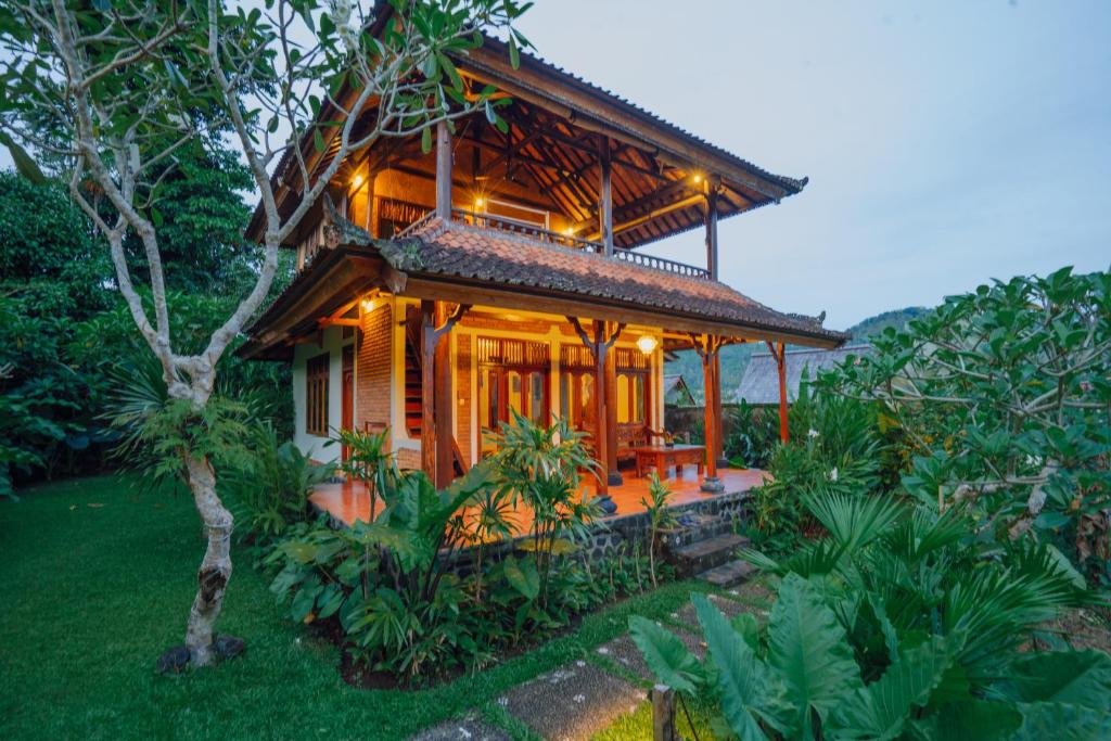 a small house with lights on the front of it at Unik Cottage in Sidemen