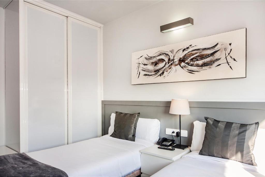 Postel nebo postele na pokoji v ubytování HOTEL SANT PERE ll HSPII