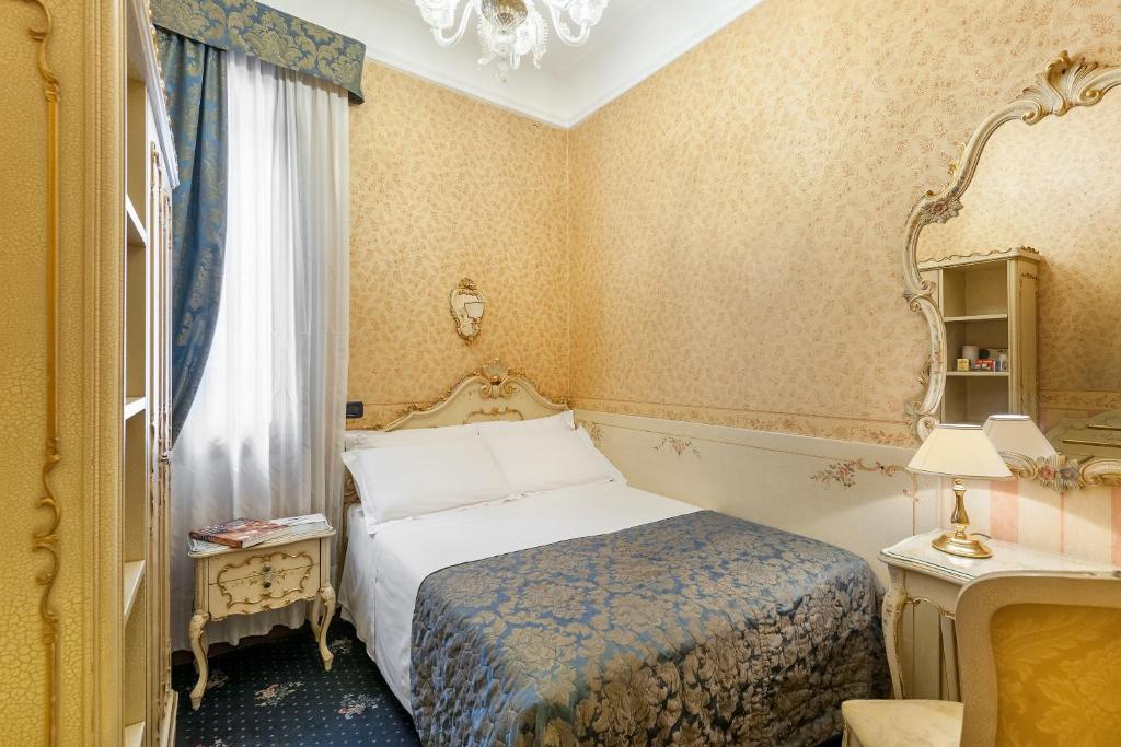 Postel nebo postele na pokoji v ubytování Hotel Montecarlo