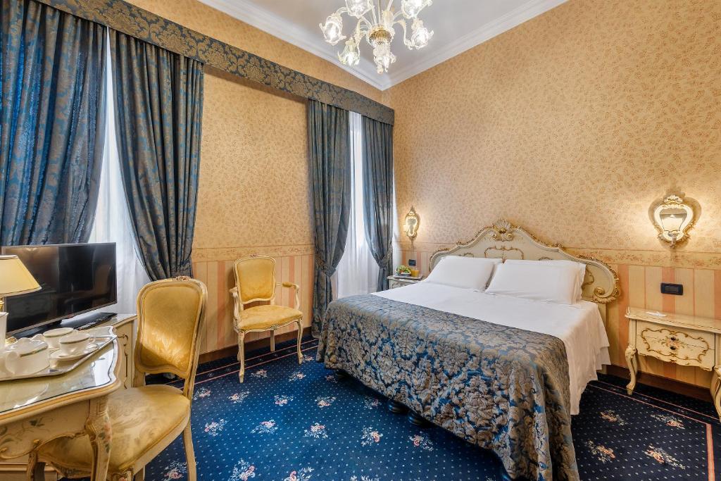 Postel nebo postele na pokoji v ubytování Hotel Montecarlo