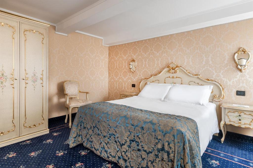 Postel nebo postele na pokoji v ubytování Hotel Montecarlo