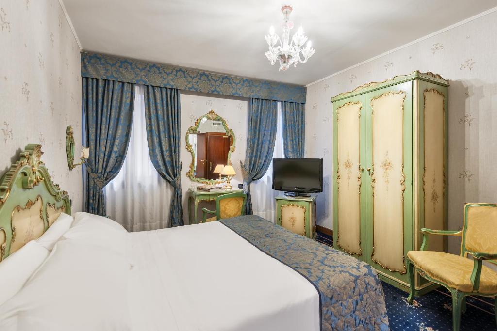 Postel nebo postele na pokoji v ubytování Hotel Montecarlo