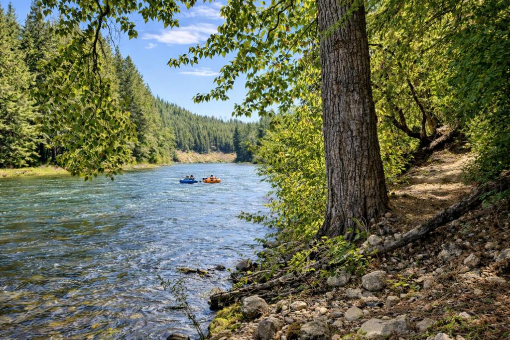 a group of people kayaking down a river at River Song Cabin home in Leavenworth