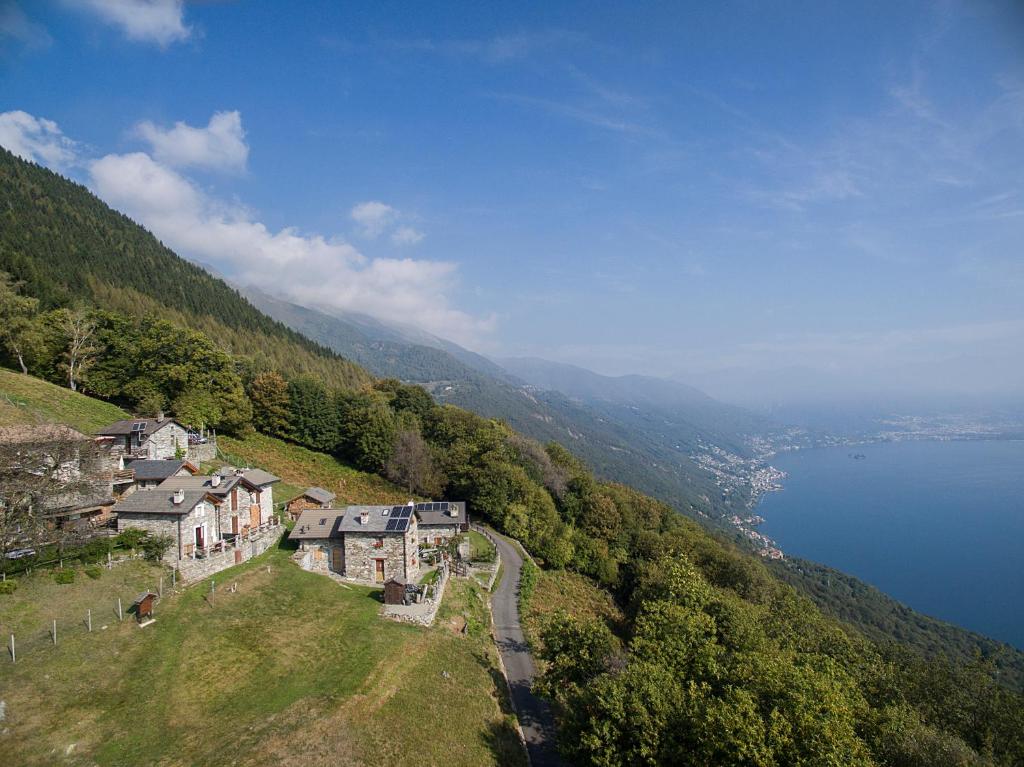 an aerial view of a village on a hill next to a lake at Agriturismo Da Attilio in Cannobio
