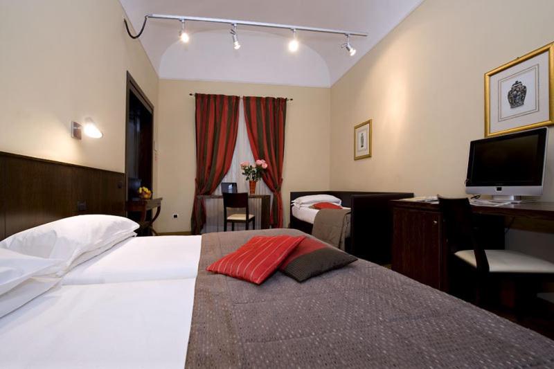 Postel nebo postele na pokoji v ubytování Hotel De Petris