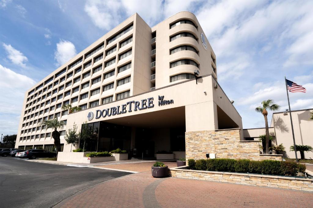 a building with a sign on the front of it at DoubleTree by Hilton Hotel Houston Hobby Airport in Houston