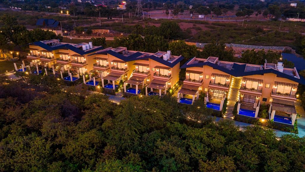 an aerial view of the resort at night at Amrutham Bagh Resort & Spa in Udaipur