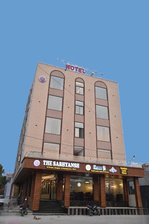 a building with a hotel sign on top of it at Hotel The Sabhyansh in Khātu